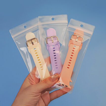 Wholesale clear EVA ziplock pouch with hanging hole watch band packaging bags held in hand, highlighting the soft frosted texture.