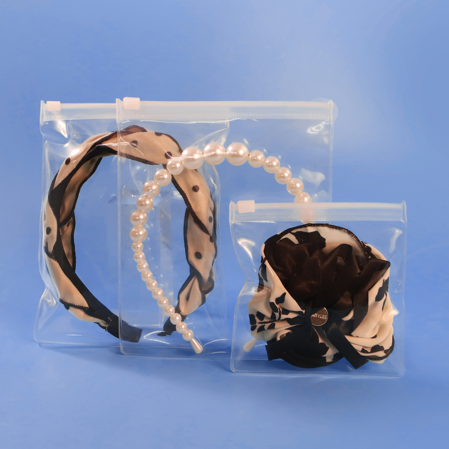Clear EVA Zipper Bags - Front Display Premium clear EVA zipper bags showcasing headbands and hair accessories in stock.