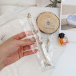 Close-up of secure ziplock closure and retail hanging hole on clear PVC budding bags