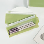Reusable frosted PVC cosmetic brush storage bag with smooth slider zipper for travel and retail packaging
