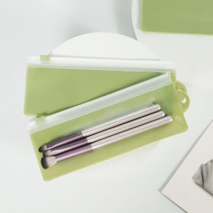 Reusable frosted PVC cosmetic brush storage bag with smooth slider zipper for travel and retail packaging