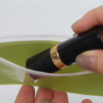 Reusable frosted PVC cosmetic brush storage bag with smooth slider zipper for travel and retail packaging