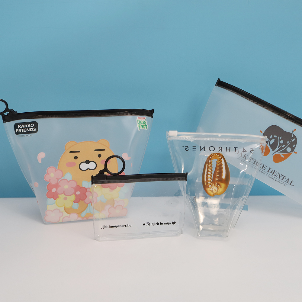 Custom printed transparent zipper pouches in different sizes and closure colors