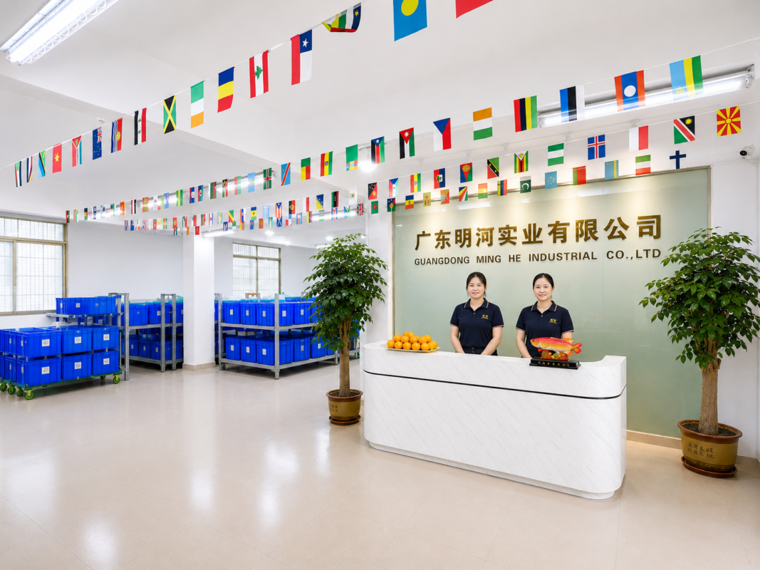Reception area of Guangdong Minghe Industrial Co., Ltd. showcasing the company name and flags.