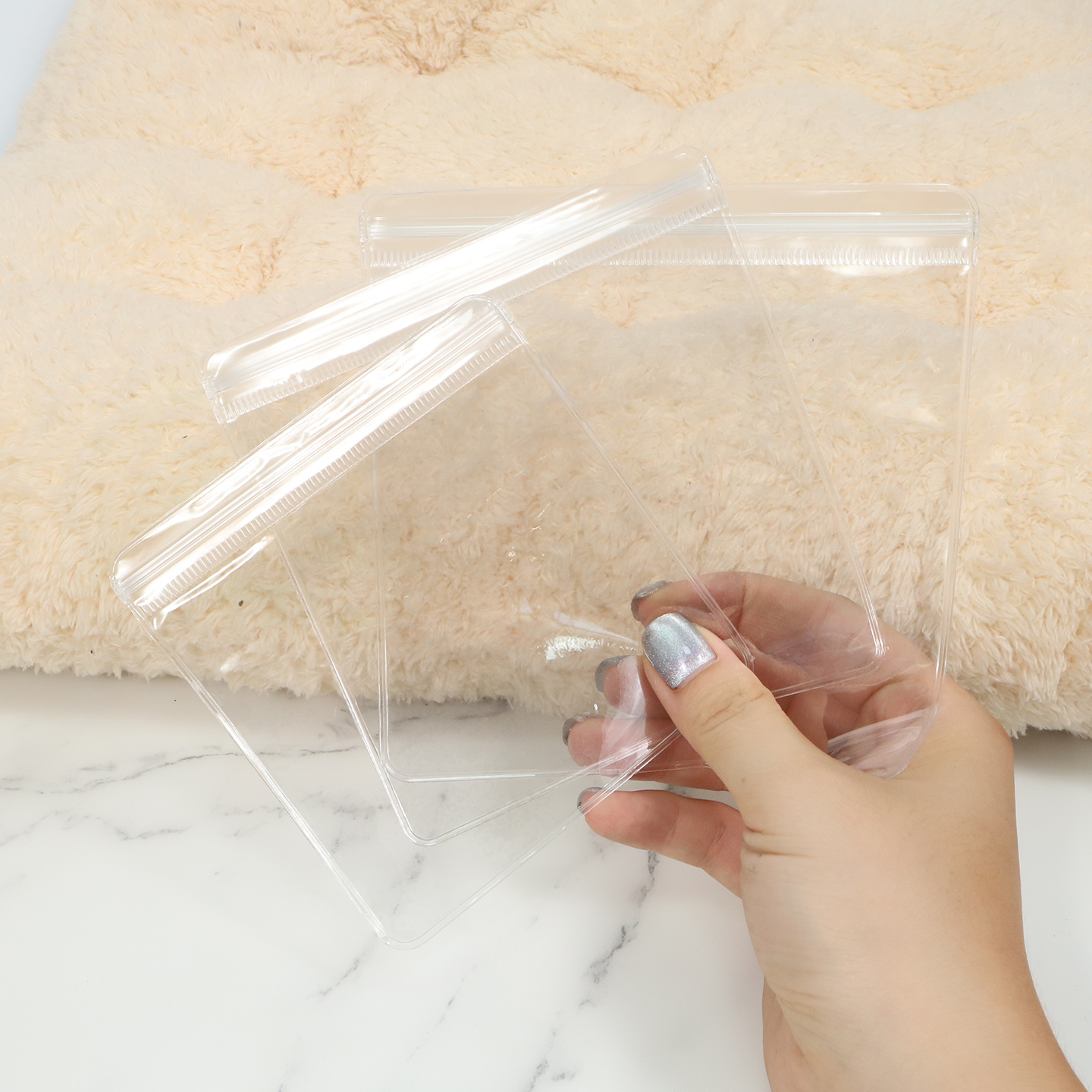 Empty clear PVC ziplock bags showing transparent film, soft structure and zipper seal.