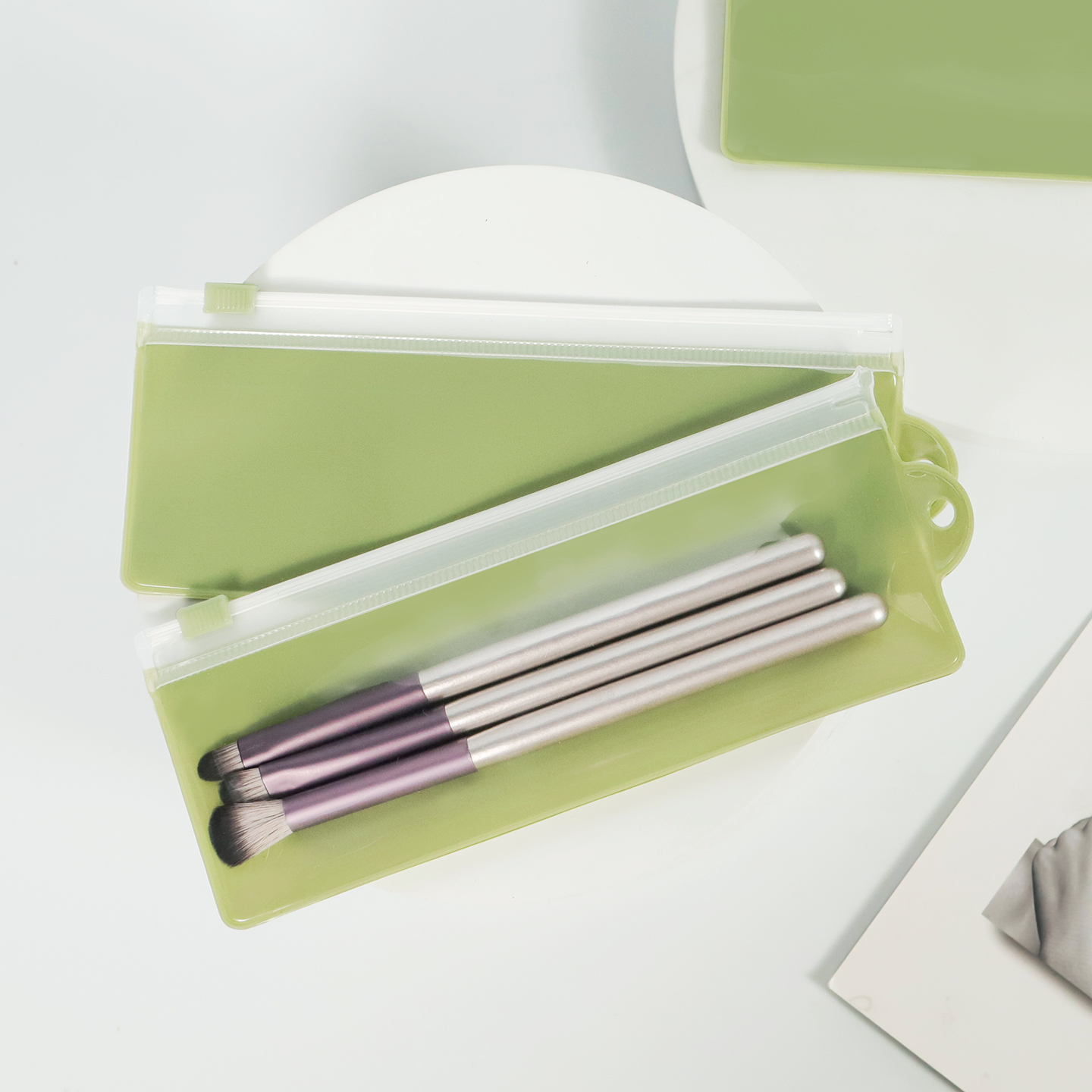 Green translucent EVA slider zipper pouch for makeup brushes