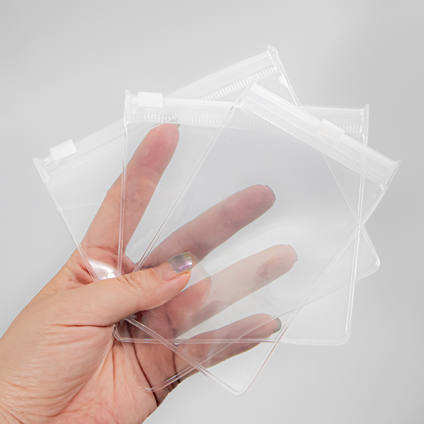 Clear EVA slider zipper bags showing flexible film and white sliders