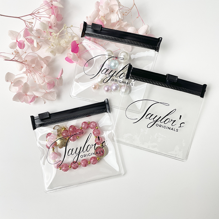 custom pvc jewelry bag with black logo, showing premium anti-tarnish packaging.