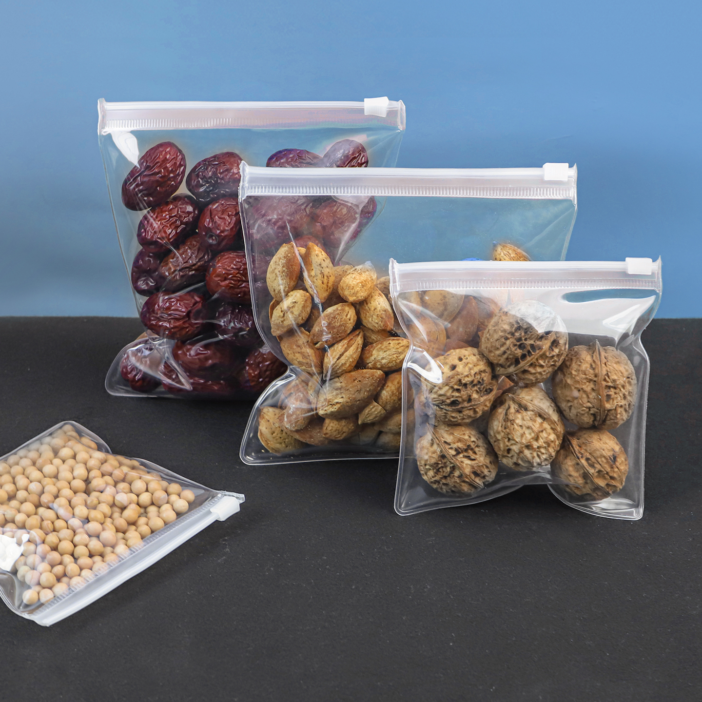 Clear food-grade EVA ziplock bags filled with dry goods like nuts and soybeans, demonstrating high clarity and FDA-compliant food safety.