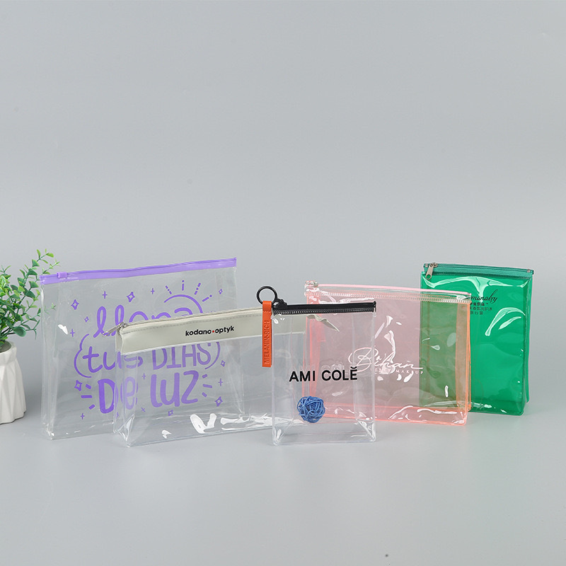 An assortment of custom clear plastic zipper bags with printed logos, demonstrating different material thicknesses and closure styles for retail packaging.