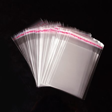 High clarity OPP self-adhesive plastic header bags fanned out for retail display.