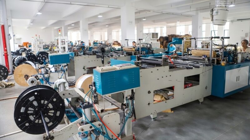 Automated production line manufacturing custom plastic packaging bags at scale.